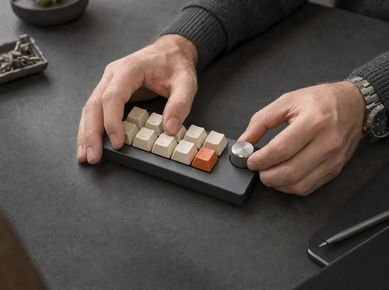 Hands on a desk control panel